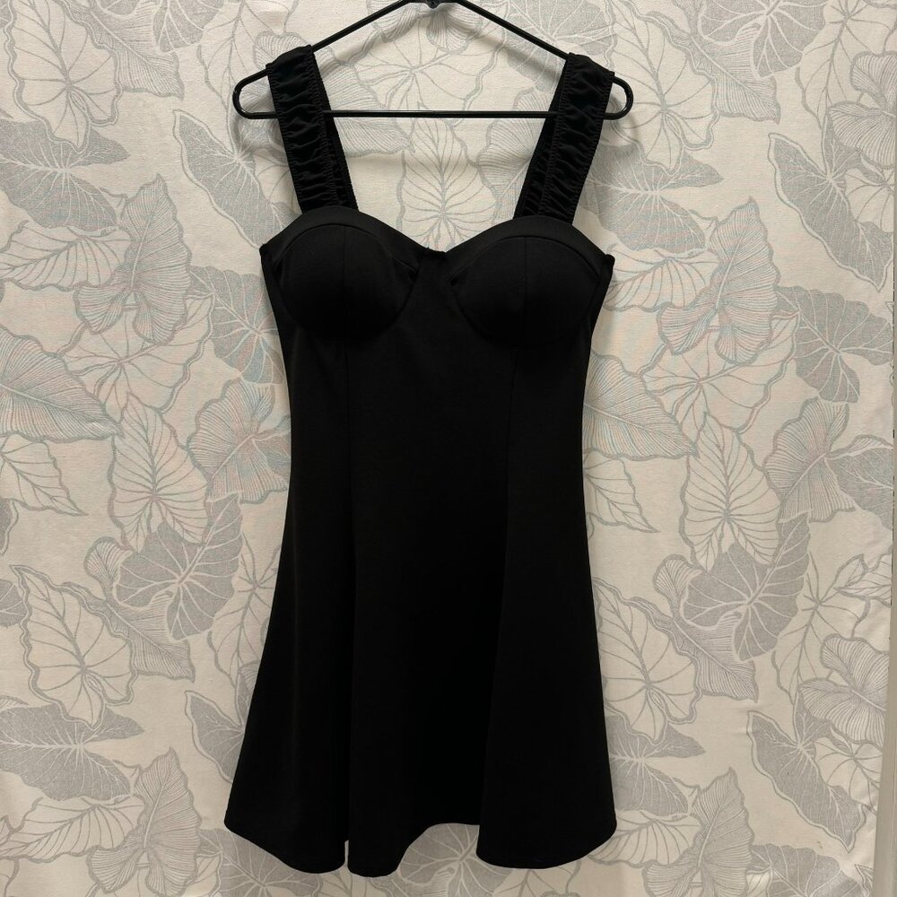 Large Short Black Dress with Exaggerated Décolletage